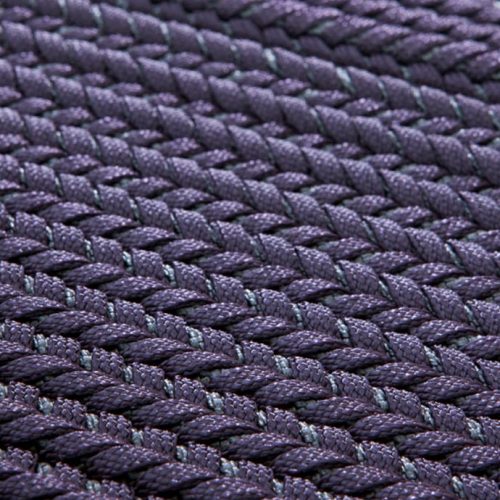 Ray rug made with purple wide braids.