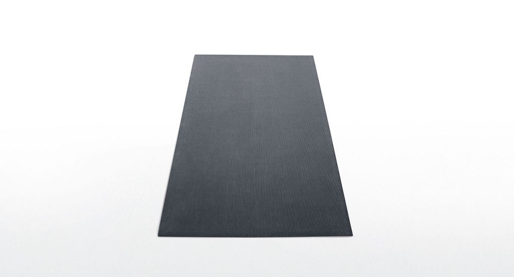 Grey Raya rug with parallel lines in relief on a white background.