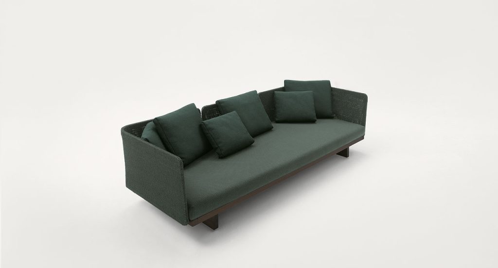 Sabi Sectional, base and two legs in natural wood, upholstery in green fabric on a white background.