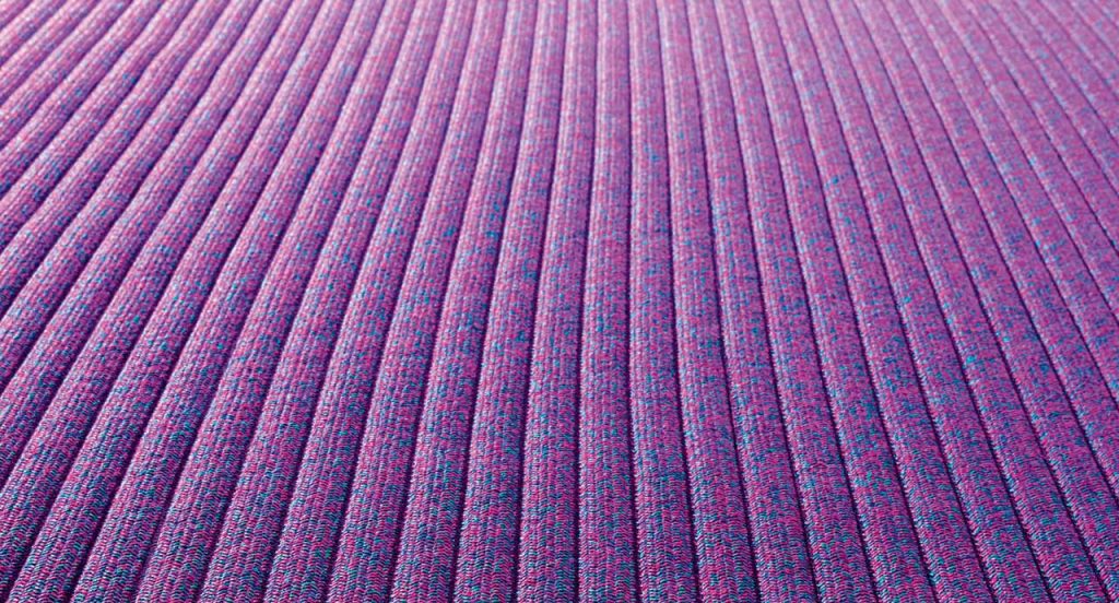 Samo rug made of purple rope cords and irregular shape.