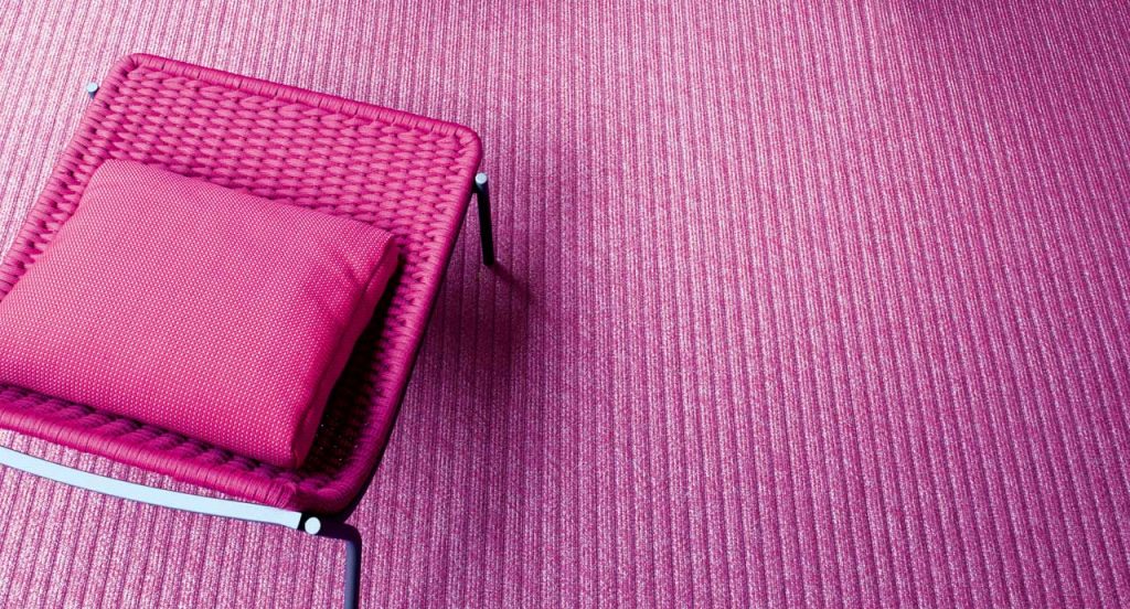 Samo rug made of pink rope cords and irregular shape.