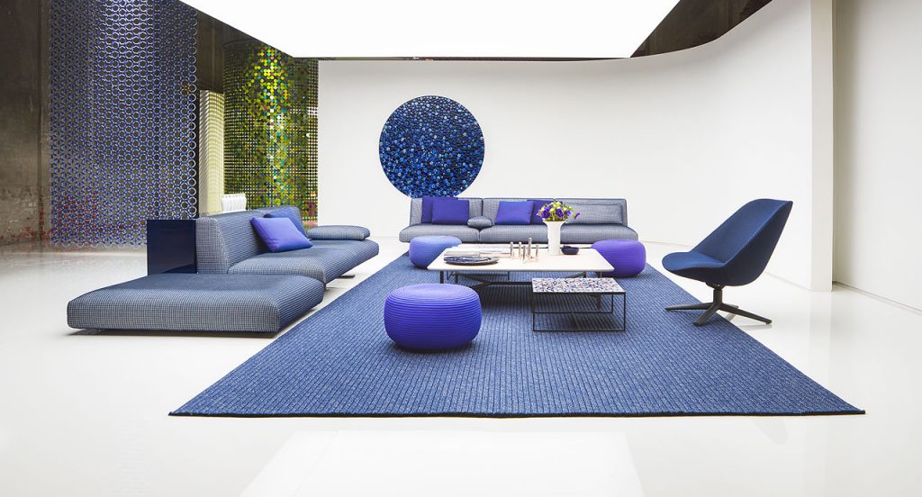 Samo rug made of blue rope cords and irregular shape in a living room.
