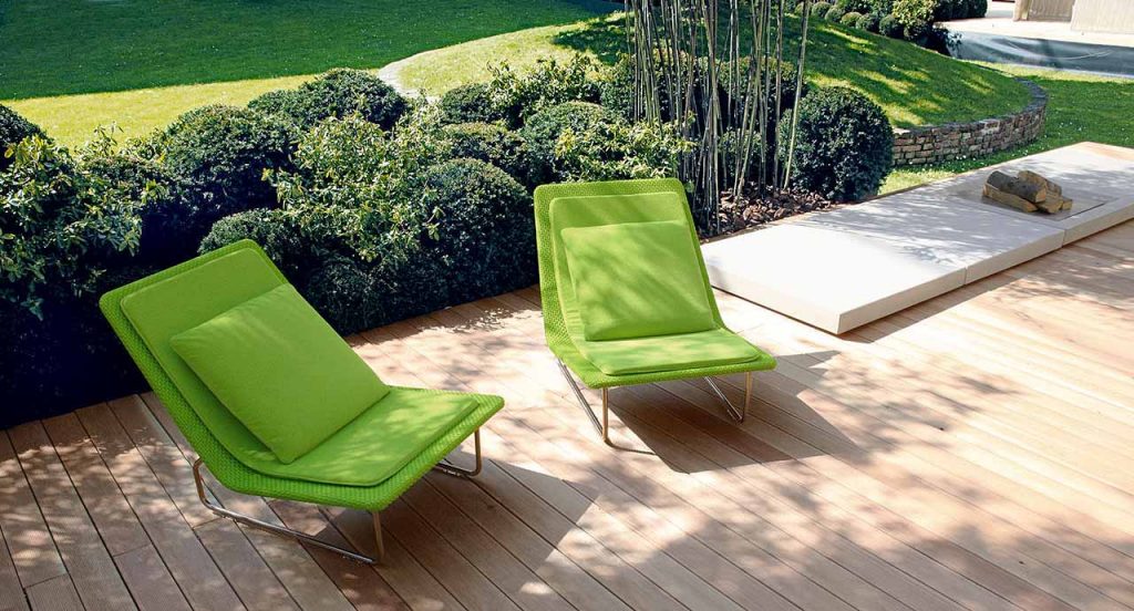 Two green Sand lounge chair with backrest, structure in steel , upholstery in rope fabric, cushion in polyester in the terrace.