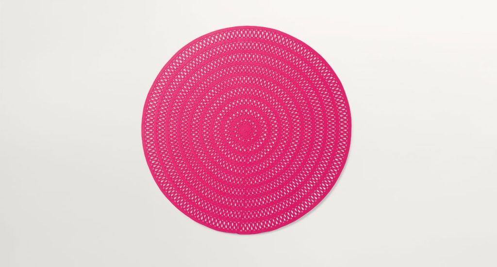 Round Shang Rug, pink cord in zig zag like pattern on a white background.