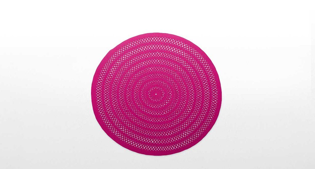 Round Shang Rug, pink cord in zig zag like pattern on a white background.