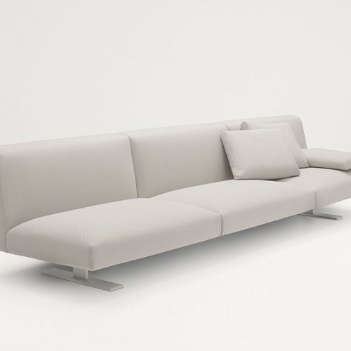 Three seater Move Sofa, upholstered in white fabric, two legs in steel on a white background.