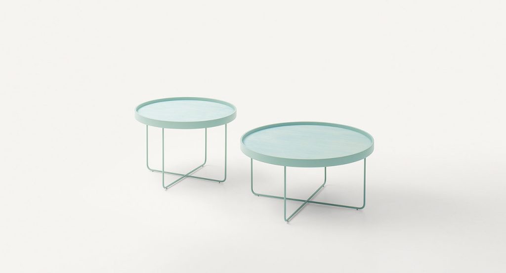 Two blue Passepartout side tables, aluminium round top, base in steel on a white background.