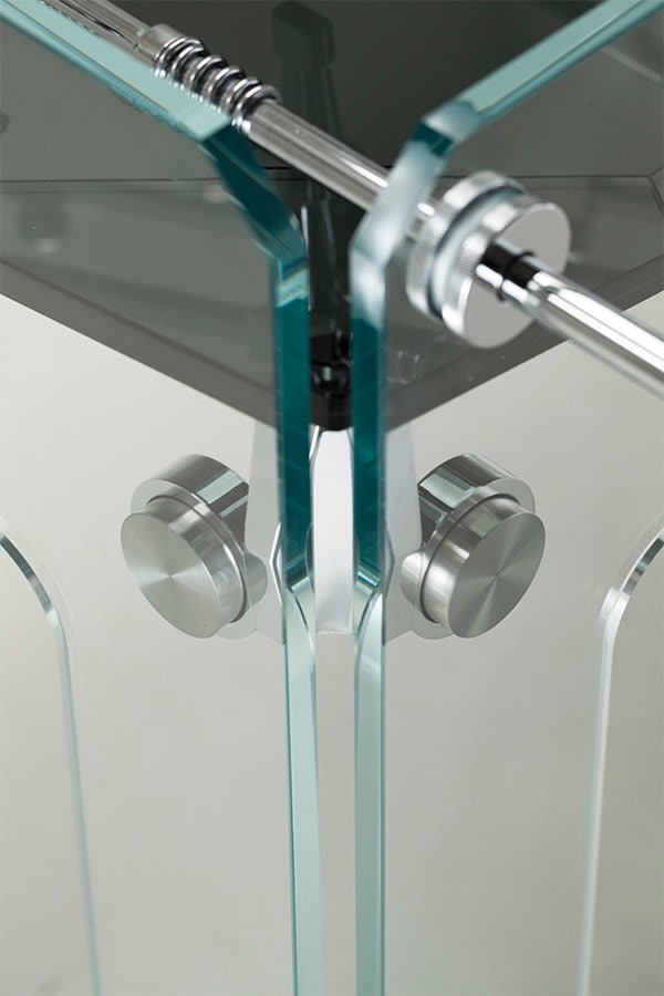 rested in thick transparent glass and shiny stainless steel bars