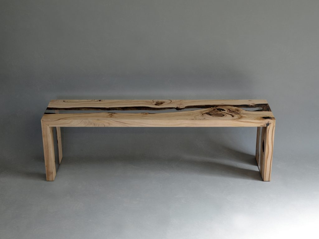 Creek Bench with a rectangular shape, made of solid wood with a natural finish and featuring a transparent resin inlay, set against a white background.