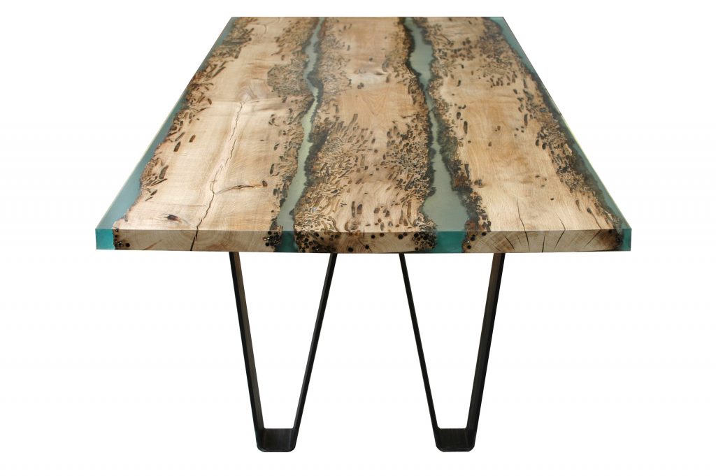 Bent Bench with a rectangular shape, made of solid wood with a natural finish and featuring a transparent resin inlay, set against a white background.