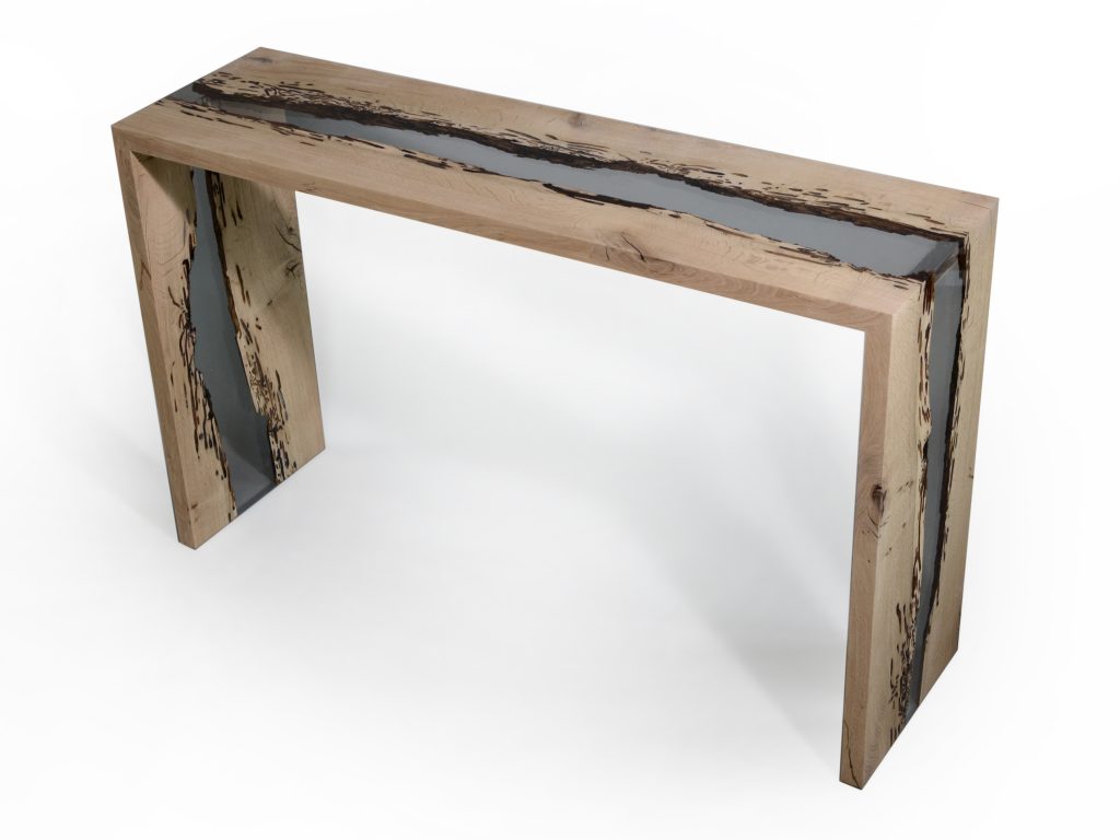 Bent River Console with an elongated shape, made of solid wood with a natural finish and featuring a transparent resin inlay, set against a white background.