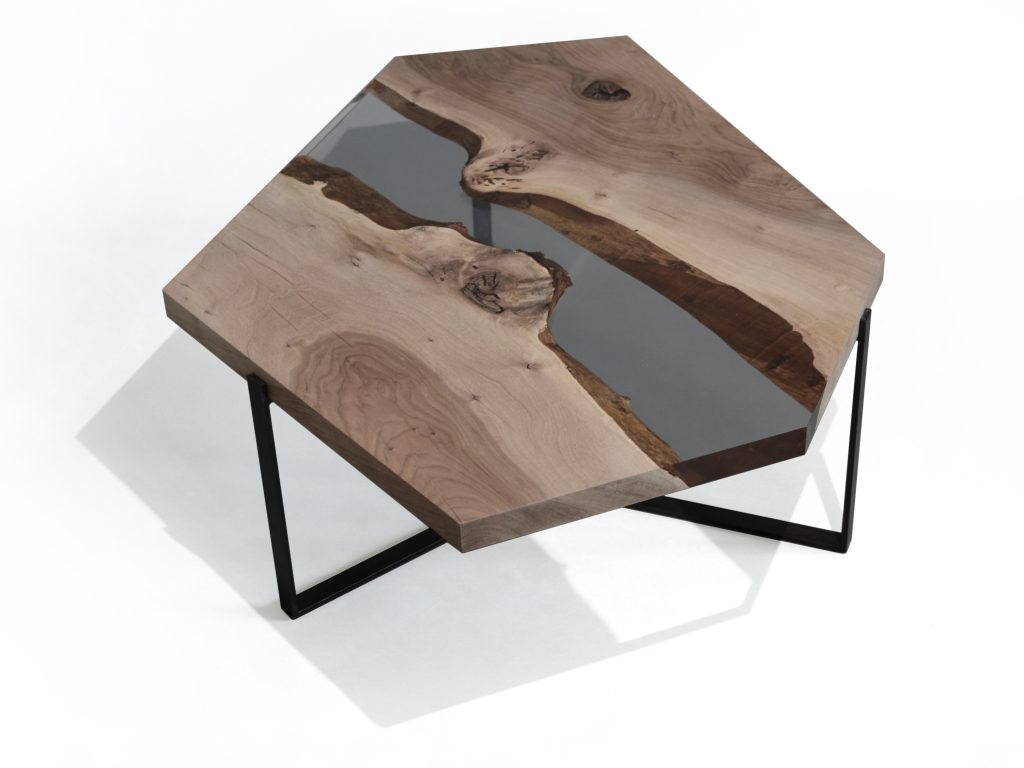 Crystal Walnut Low Table with a polygonal shape, made of solid walnut wood with a natural finish and featuring a transparent resin inlay, set against a white background.