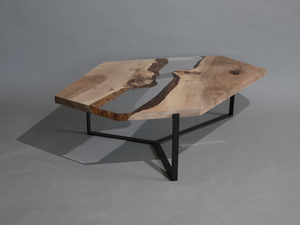 Crystal Walnut Low Table with a polygonal shape, made of solid walnut wood with a natural finish and featuring a transparent resin inlay, set against a white background.