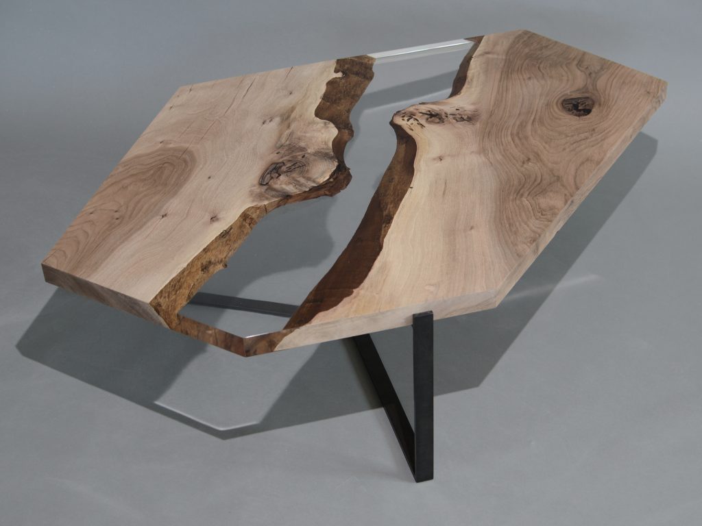 Crystal Walnut Low Table with a polygonal shape, made of solid walnut wood with a natural finish and featuring a transparent resin inlay, set against a white background.