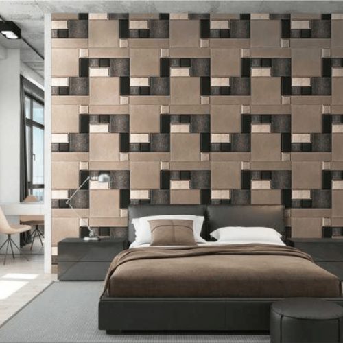 Absolute mosaic with square patterns in brown, gray, white and black on a wall.