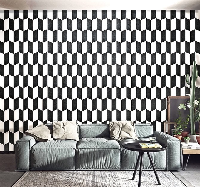 Sense mosaic in white and black tones with a polygonal pattern in a wall.