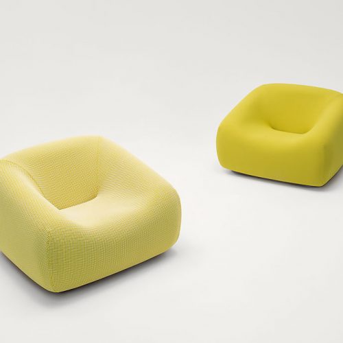 Two Smile Indoor Armchairs, upholstery in yellow fabric on a white background.