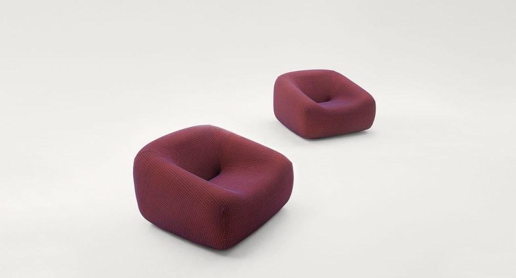 Two Smile Indoor Armchairs, upholstery in red fabric on a white background.