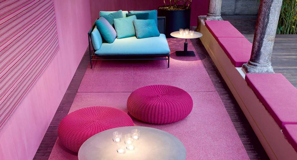 Two Shell poufs, upholstery in pink rope in the yard.