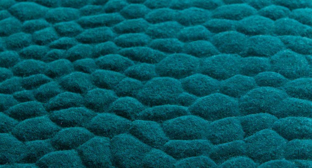 Blue Shore rug, rounded forms in relief in the wool surface.