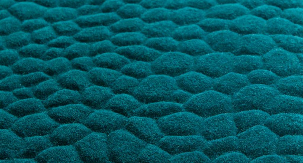 Blue Shore rug, rounded forms in relief in the wool surface.