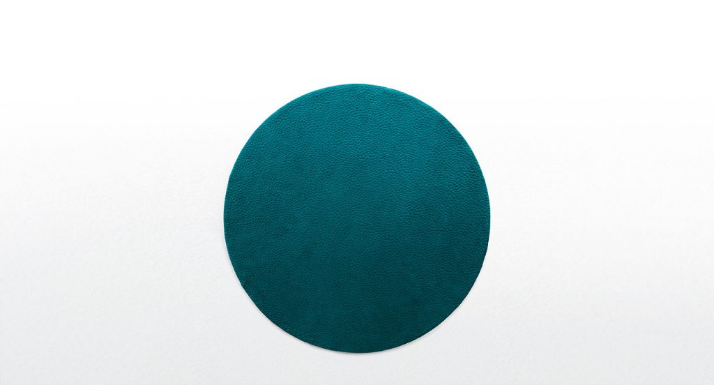 Blue Shore rug, rounded forms in relief in the wool surface on a white background.