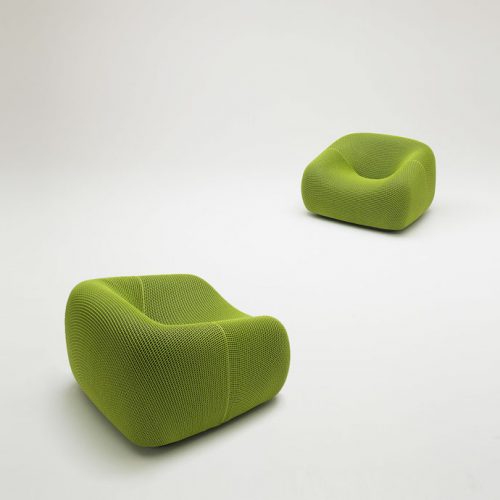 Two Smile Outdoor Armchairs, upholstered in green aero fabric on a white background.
