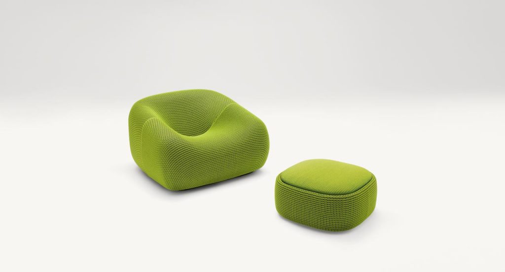 Smile Outdoor Armchair, upholstered in green aero fabric on a white background.