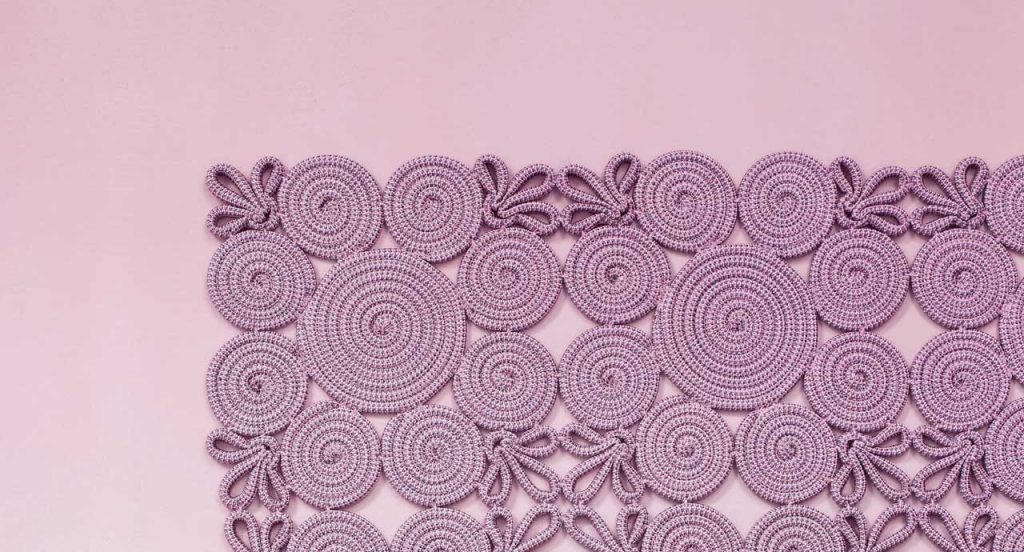 Spin Modular Rug made of purple sewn spirals and leaves on a purple background.