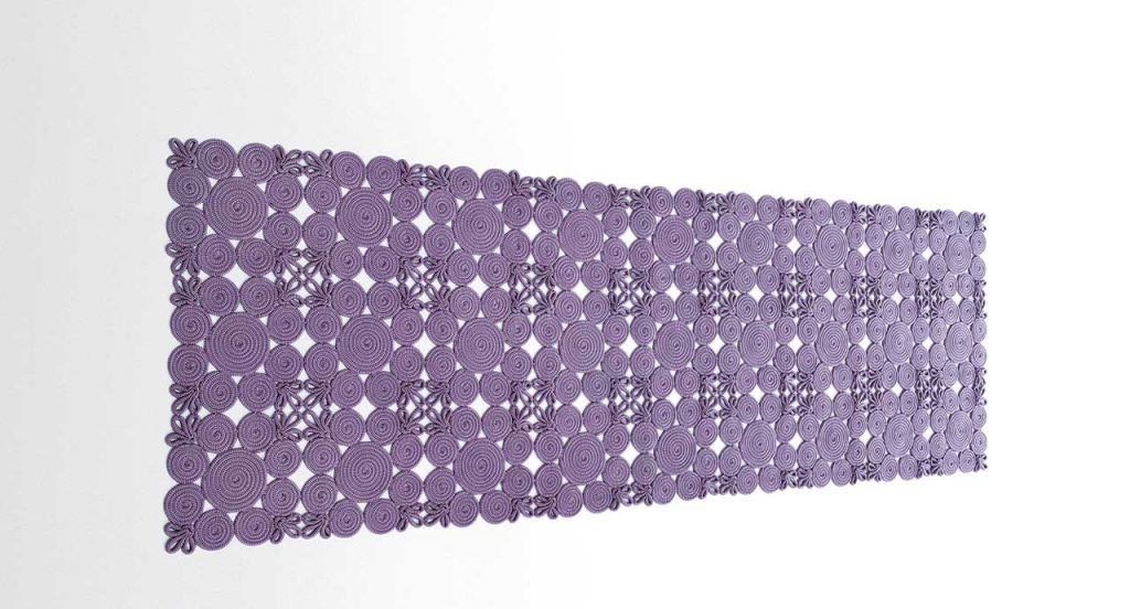 Spin Modular Rug made of purple sewn spirals and leaves on a white background.