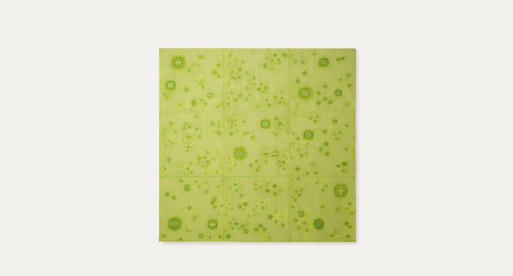 Spring Modular Rug with embroidered floral pattern in green on a white background.