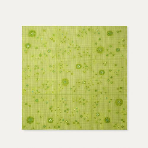 Spring Modular Rug with embroidered floral pattern in green on a white background.