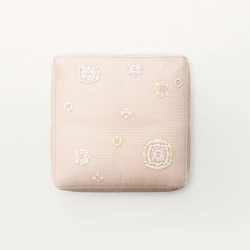Square Spring Pouf in pink Kimia fabric embroidered upholstery on a white background.