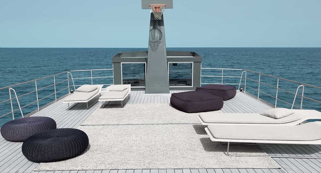 Four Surf sun beds with backrest, structure in steel, upholstery in grey on a boat.