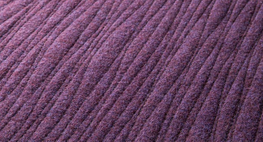 Purple Tatami rug, embriordey of series of parallel, irregular lines.