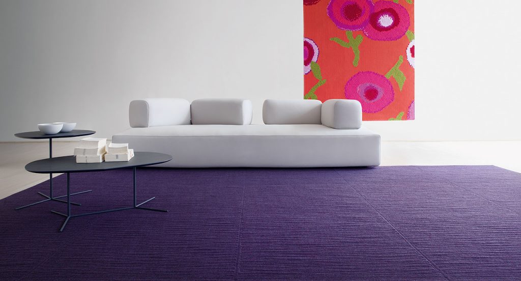 Purple Tatami rug, embriordey of series of parallel, irregular lines in a living room.
