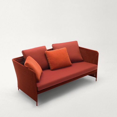Red Teatime Sofa with armrest. Upholstery of braids in rope on a white background.