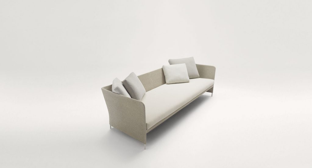 Brown and white Teatime Sofa with armrest. Upholstery of braids in rope on a white background.