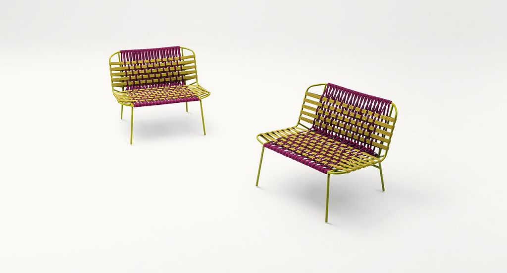 Two Telar Lounge Chairs. Structure and four legs in green steel, upholstery weave in pink and green on a white background.