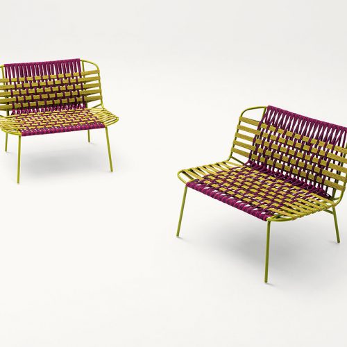 Two Telar Lounge Chairs. Structure and four legs in green steel, upholstery weave in pink and green on a white background.