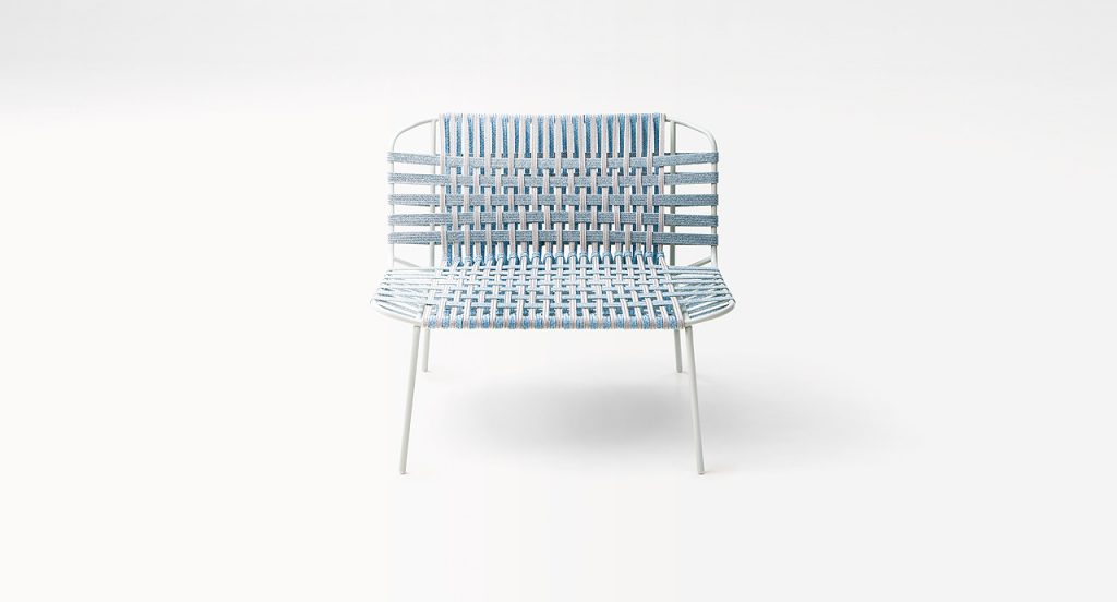 Blue Telar Lounge Chair. Structure and four legs in steel, upholstery weave on a white background.