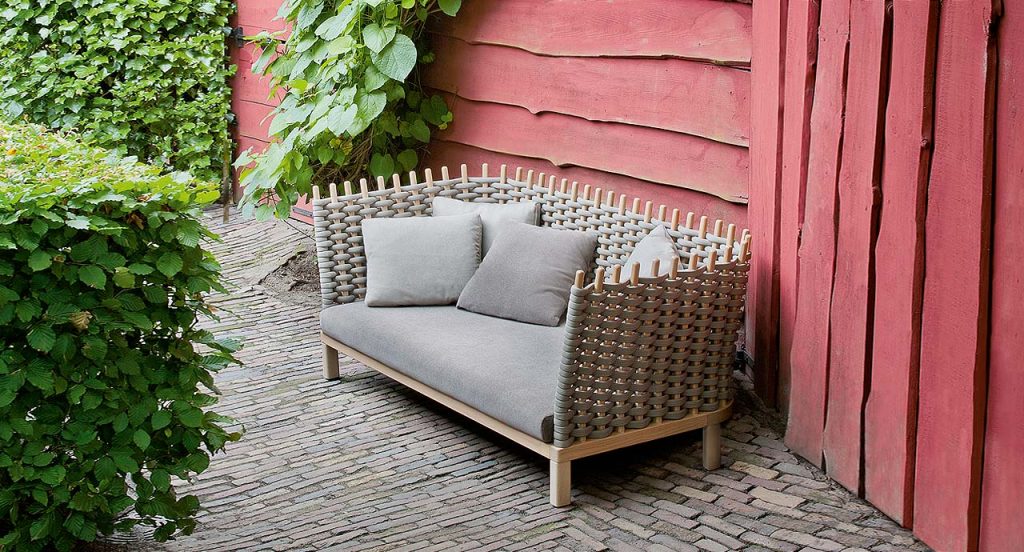 Wavi sofa, structural melange weave and wood in natural color, white seat cushion in the outside.