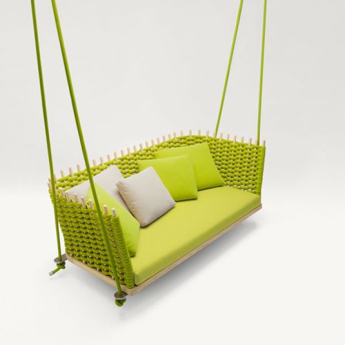 Green lawn swing covered with rope yarn, cushion upholstery on a white background.