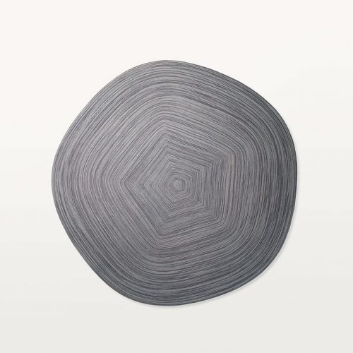 Grey Zoe Natural rug wool cord in a pentagonal form on a white background.