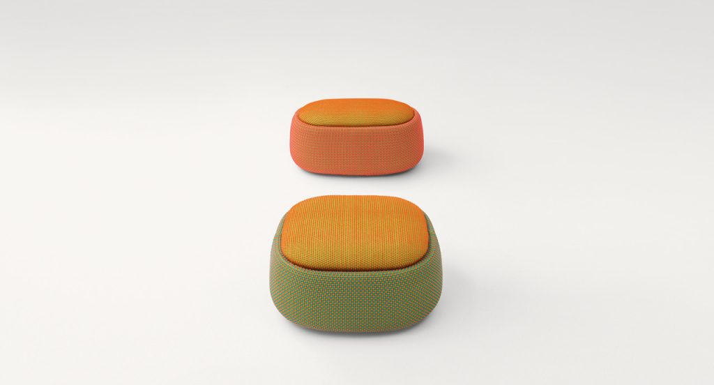Two Smile Indoor Pouf, upholstered in blend y dots fabric , one in green and yellow, one in orange and yellow on a white background.