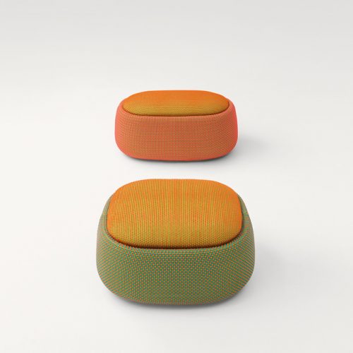 Two Smile Indoor Pouf, upholstered in blend y dots fabric , one in green and yellow, one in orange and yellow on a white background.