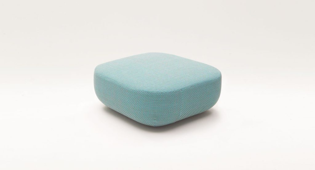Uptown Pouf, blue fabrics upholstery on a white background.