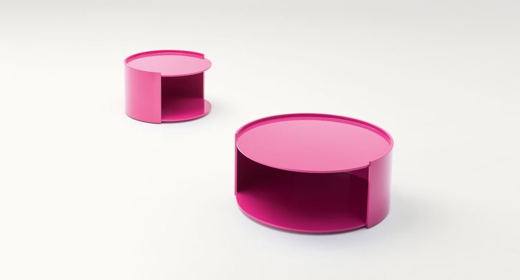 Two Pink Walt Side Tables with side opening and round shape on a white background.