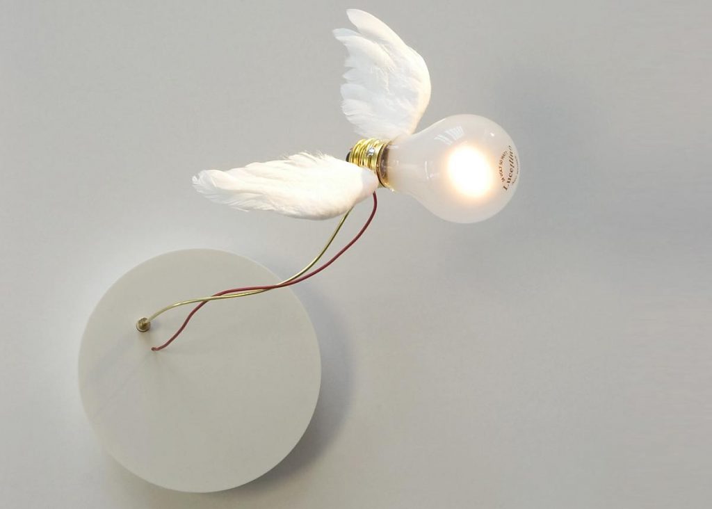 A Lucellino light with white wings that is on a white wall