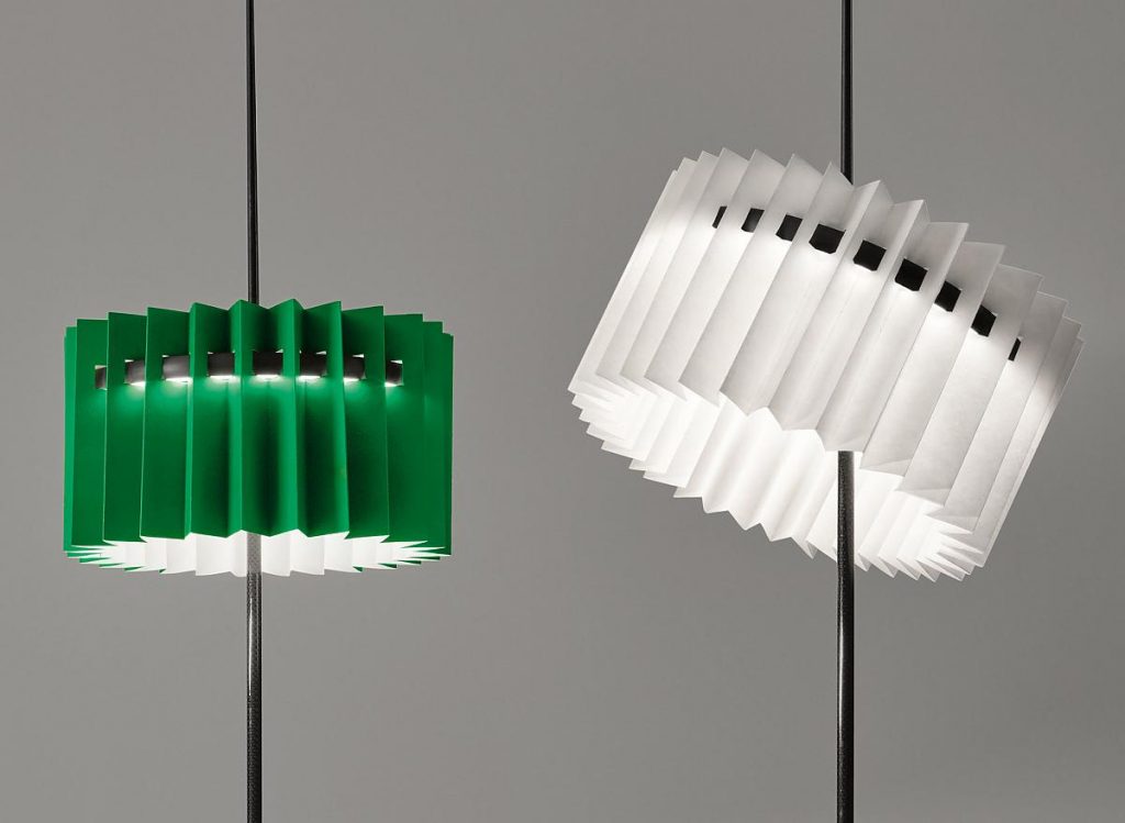A couple of Ringelpietz lamps, one with a green shade and another with a white shade